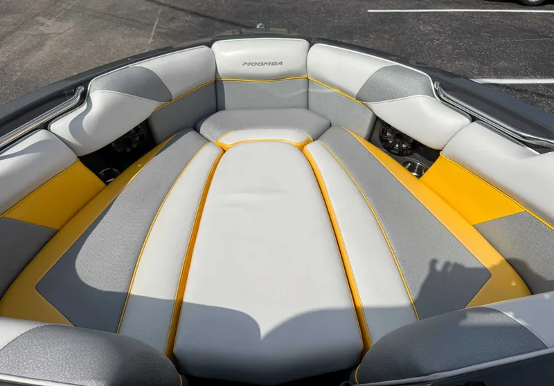 Slide: The Image of 2016 Moomba Craz boat interior with gray and yellow seating. - 12