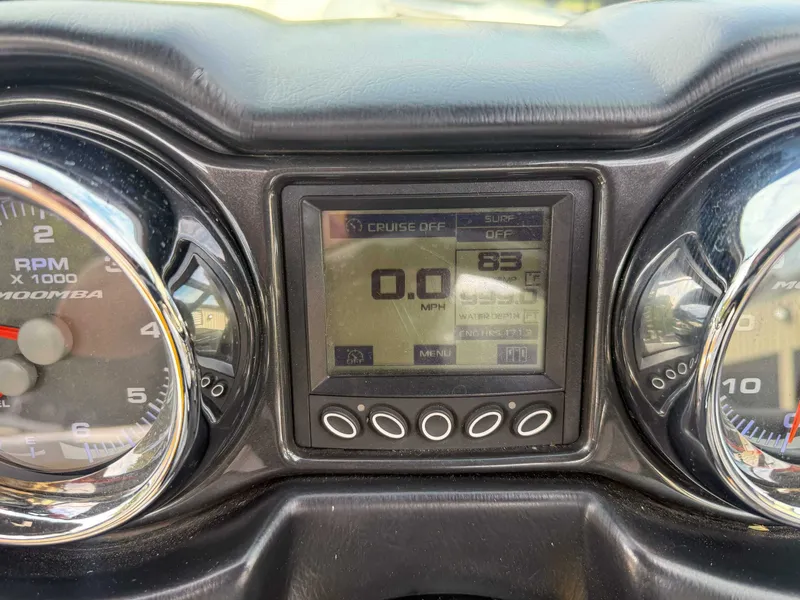 Slide: The Image of Dashboard of a 2016 Moomba Craz boat showing RPM and digital display. - 17