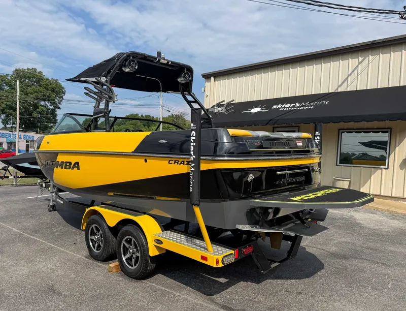 Slide: The Image of 2016 Moomba Craz boat in yellow and black, parked at Skier's Marine dealership. - 8