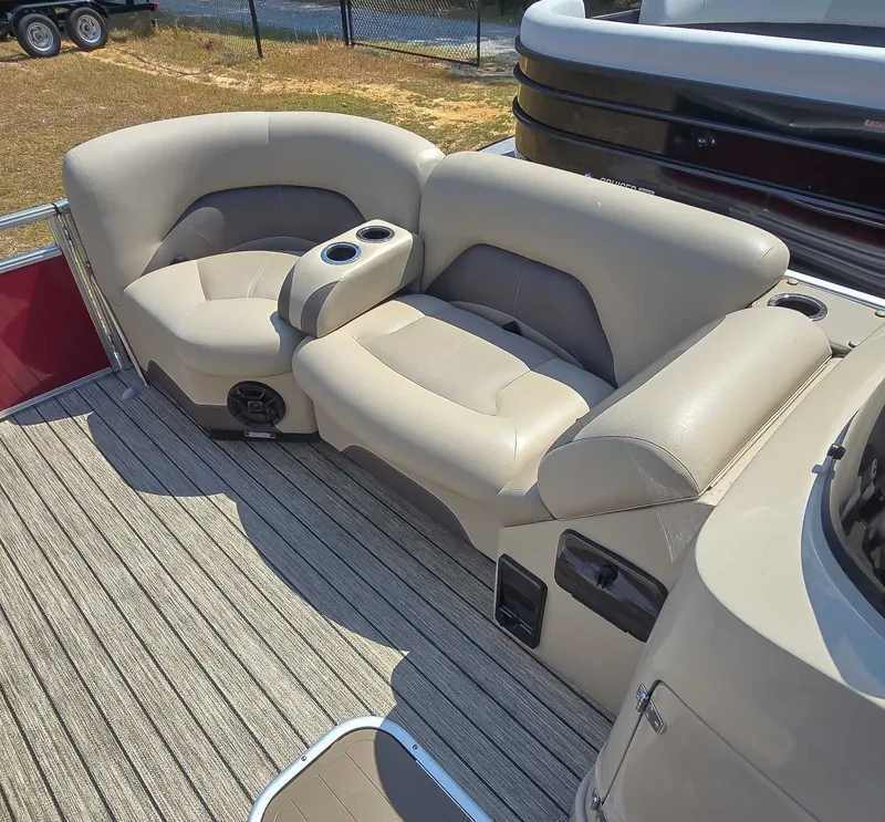 Slide: The Image of Luxurious seating on 2020 Landau ATLANTIS boat with cup holders and striped flooring. - 7