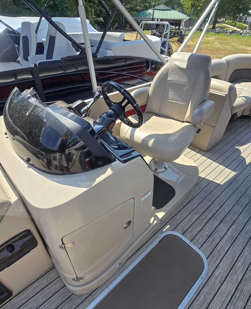 Slide: The Image of 2020 Landau ATLANTIS boat interior with beige captain's chair and steering console. - 9