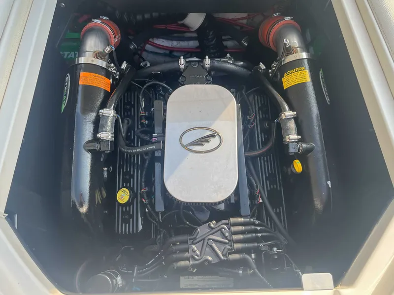 Slide: The Image of 2014 Tigé RZR engine compartment with visible components and wiring. - 21