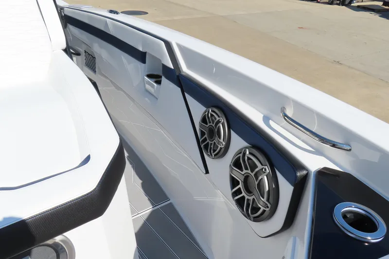 Slide: The Image of 2026 Sunsation 32CCX boat interior with sleek design and built-in speakers. - 15