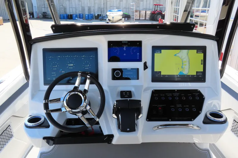 Slide: The Image of 2026 Sunsation 32CCX boat dashboard with advanced navigation and control systems. - 17
