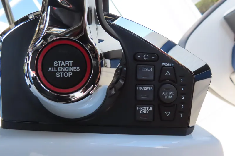 Slide: The Image of Control panel of 2026 Sunsation 32CCX boat with engine start and trim buttons. - 23