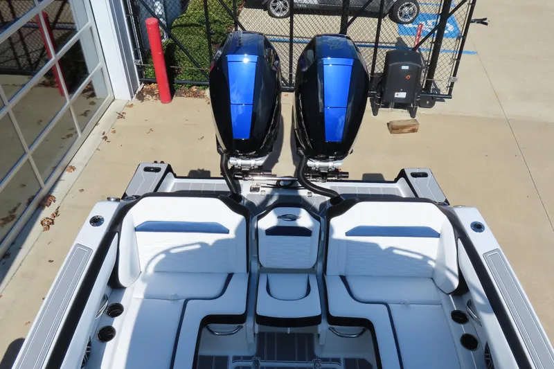 Slide: The Image of 2026 Sunsation 32CCX boat with dual engines and sleek white seating. - 24