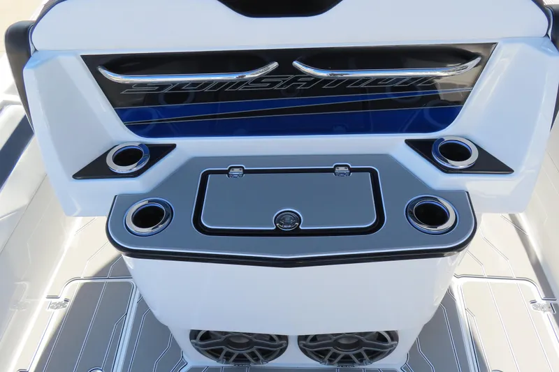 Slide: The Image of 2026 Sunsation 32CCX boat interior with cup holders and storage compartment. - 28