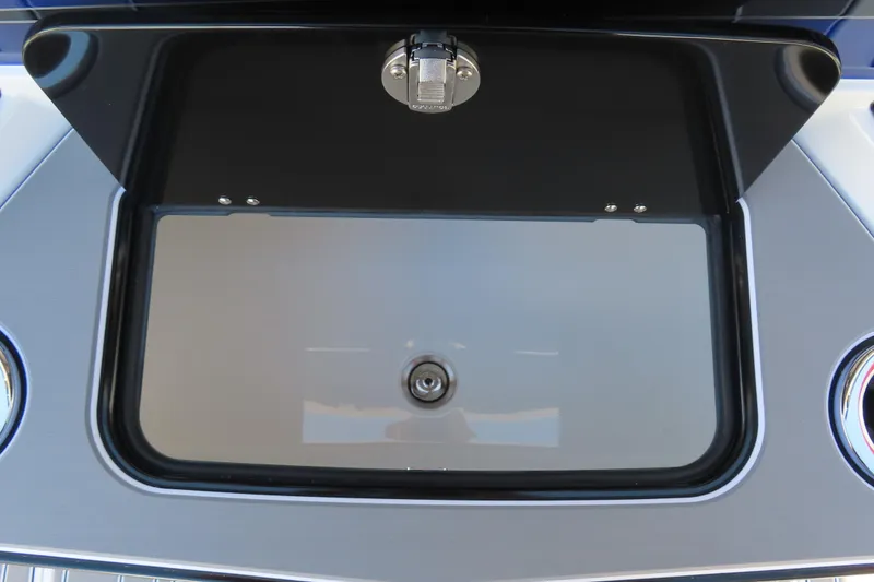 Slide: The Image of Open storage compartment on 2026 Sunsation 32CCX boat. - 29