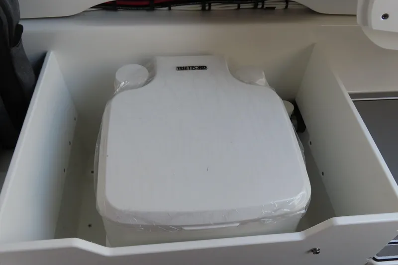 Slide: The Image of Portable toilet in 2026 Sunsation 32CCX boat, enclosed in a white compartment. - 33