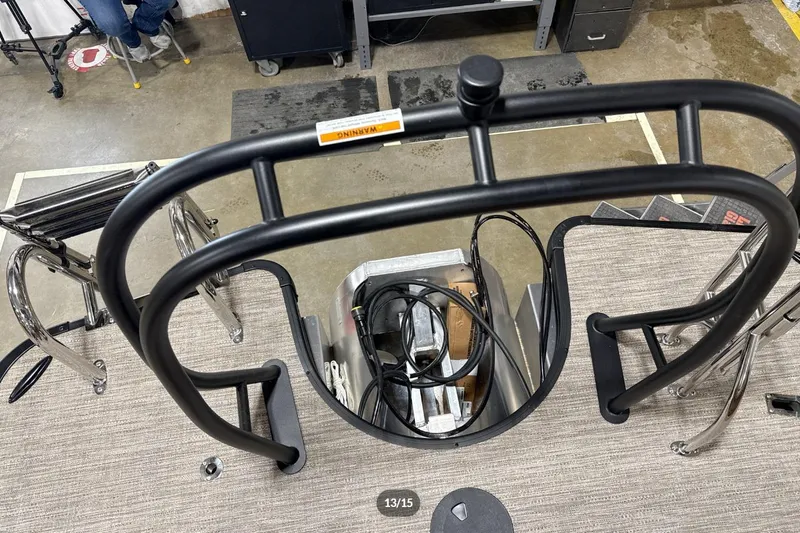 Slide: The Image of 2026 Godfrey Monaco 23' Tritoon deck view with safety railing and equipment. - 14