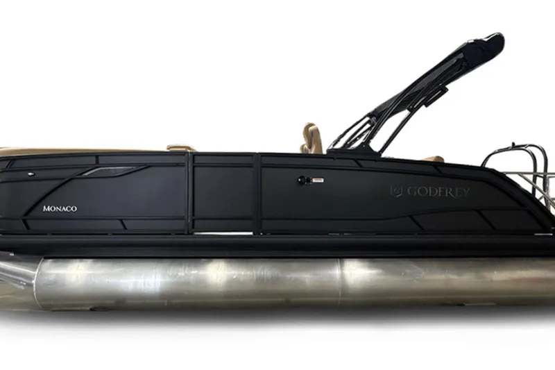 Slide: The Image of 2026 Godfrey Monaco 23' Tritoon with sleek black design and modern features. - 2
