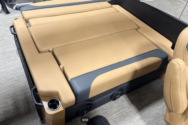 Slide: The Image of Luxurious tan seating on 2026 Godfrey Monaco 23' Tritoon boat, featuring cup holders and sleek design. - 7