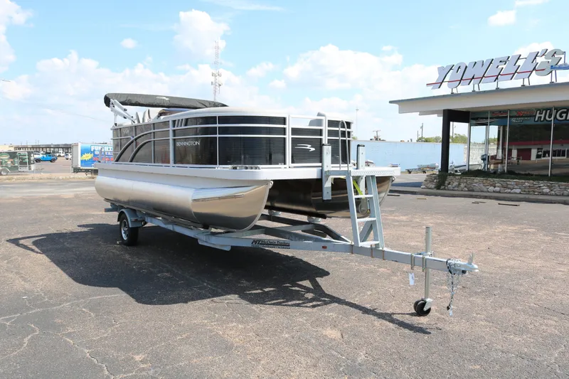 Slide: The Image of 2026 Bennington 20SSRCX pontoon boat on trailer at Yowell's Boat Yard. - 1