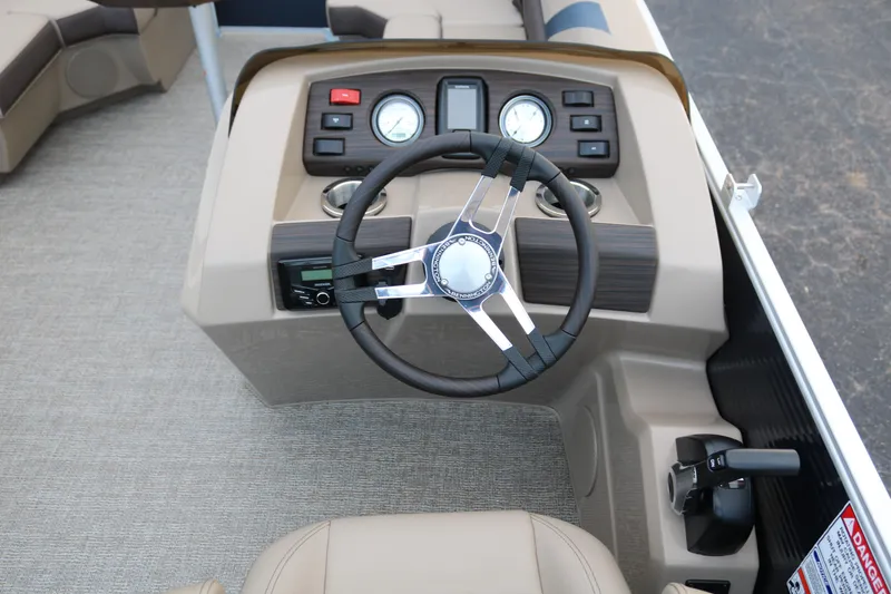 Slide: The Image of 2026 Bennington 20SSRCX STERN RADIUS boat seating with storage compartment open. - 15