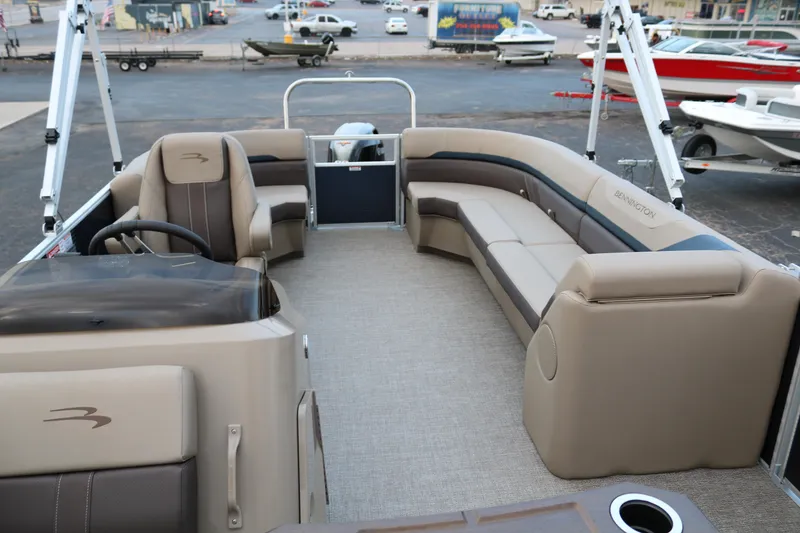 Slide: The Image of 2026 Bennington 20SSRCX boat interior with plush seating and cup holders. - 16