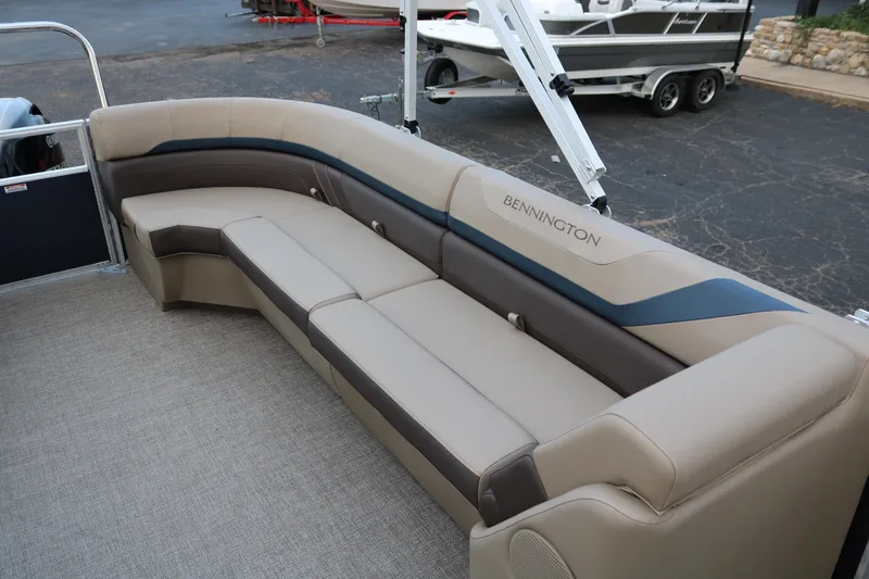 Slide: The Image of 2026 Bennington 20SSRCX Stern Radius boat interior with sleek gray seating. - 17