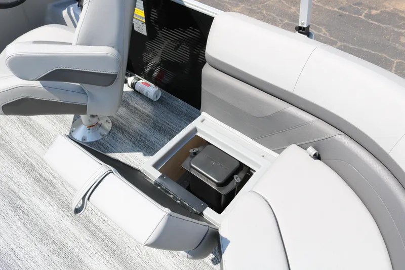 Slide: The Image of 2026 Bennington 20SSRCX boat interior with storage compartment and seating. - 29