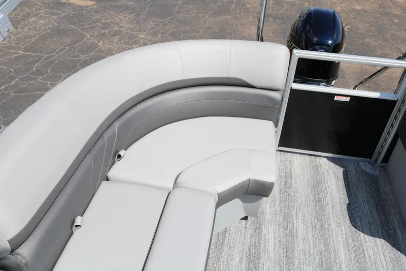 Slide: The Image of 2026 Bennington 20SSRCX STERN RADIUS boat interior with gray seating and motor. - 30