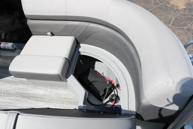 Slide: The Image of 2026 Bennington 20SSRCX STERN RADIUS boat seat with storage compartment open. - 31