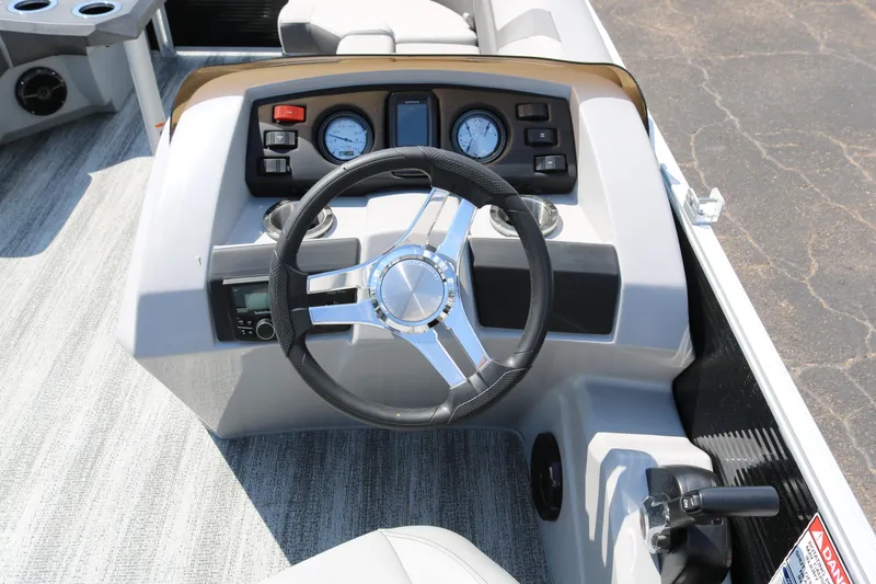 Slide: The Image of 2026 Bennington 20SSRCX STERN RADIUS boat dashboard with steering wheel and gauges. - 33