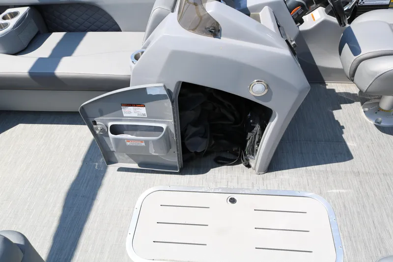 Slide: The Image of 2026 Bennington 20SSRCX boat interior with open storage compartment and seating. - 35