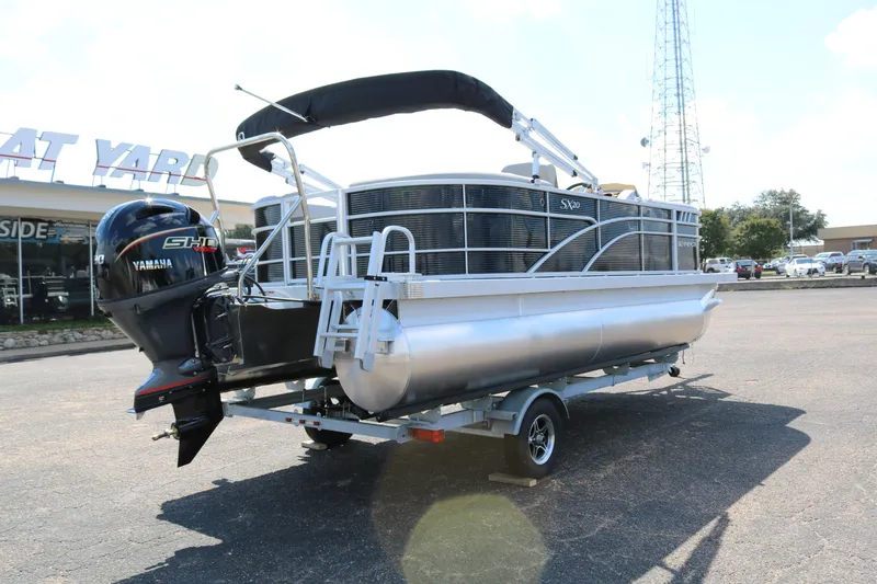 Slide: The Image of 2026 Bennington 20SSRCX STERN RADIUS pontoon boat with Yamaha engine on trailer. - 7