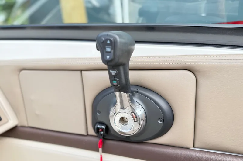 Slide: The Image of Throttle control of a 2013 Sea Ray 250 SLX boat, featuring a sleek design. - 16