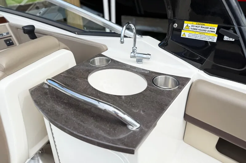 Slide: The Image of 2013 Sea Ray 250 SLX boat interior with sink and countertop detail. - 5