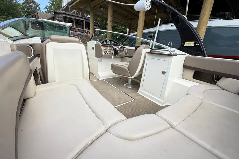 Slide: The Image of 2013 Sea Ray 250 SLX boat interior with seating and control panel. - 8