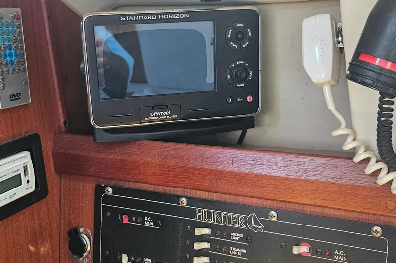 Slide: The Image of Control panel of a 1991 Hunter 34 sailboat with navigation equipment. - 10