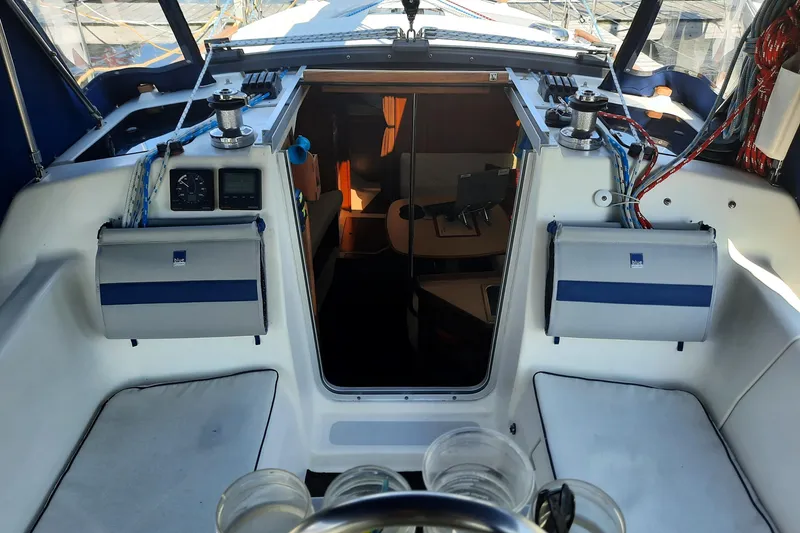 Slide: The Image of Cockpit view of a 1992 Hunter 33.5 sailboat, showing interior cabin entrance. - 6