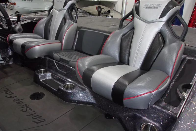 Slide: The Image of 2022 Skeeter boat interior with sleek, modern seats and cup holders. - 15