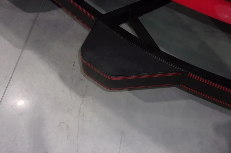 Slide: The Image of Close-up of a 2022 Skeeter boat trailer with black and red detailing. - 20
