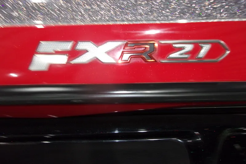 Slide: The Image of Red Skeeter FXR 21 boat emblem, 2022 model, with metallic accents. - 23