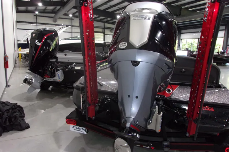 Slide: The Image of 2022 Skeeter boat with powerful 350 engine in a showroom setting. - 4