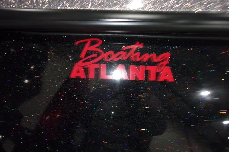 Slide: The Image of "Boating Atlanta" logo on a 2022 Skeeter boat with a glittery finish. - 6