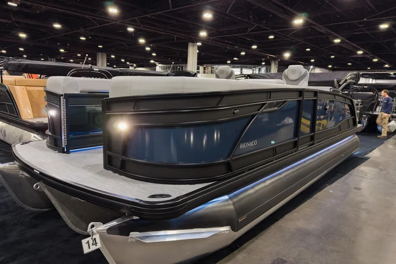 The Image of 2026 Godfrey Monaco 235 Single Flip Lounge pontoon boat displayed indoors. - 0