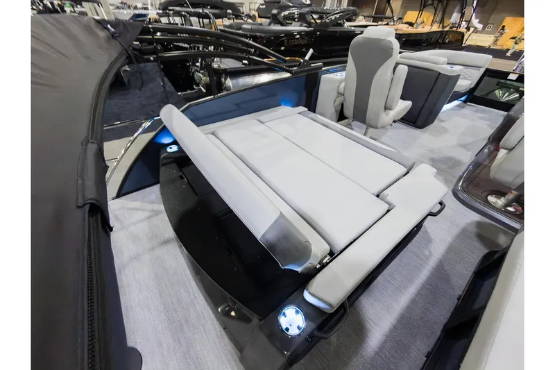 Slide: The Image of 2026 Godfrey Monaco 235 boat with single flip lounge seating, modern interior design. - 24