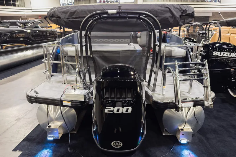 Slide: The Image of 2026 Godfrey Monaco 235 pontoon boat with powerful 200 HP engine, showcased indoors. - 3