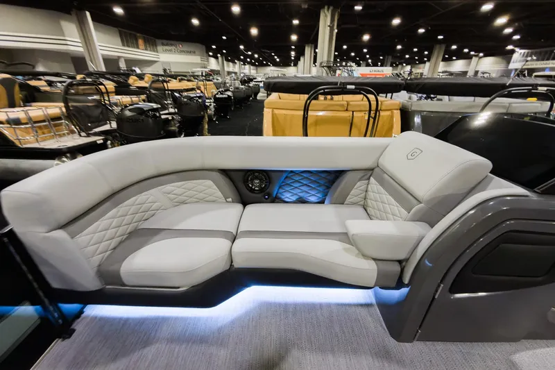 Slide: The Image of Luxurious seating on 2026 Godfrey Monaco 235 Single Flip Lounge boat, featuring elegant design and ambient lighting. - 5