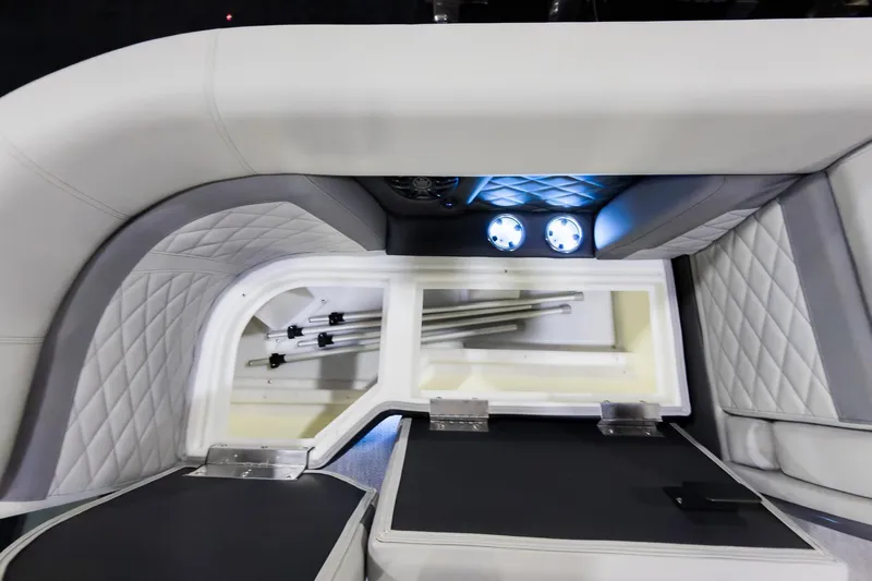 Slide: The Image of Interior view of 2026 Godfrey Monaco 235 boat with storage compartment and LED lighting. - 6