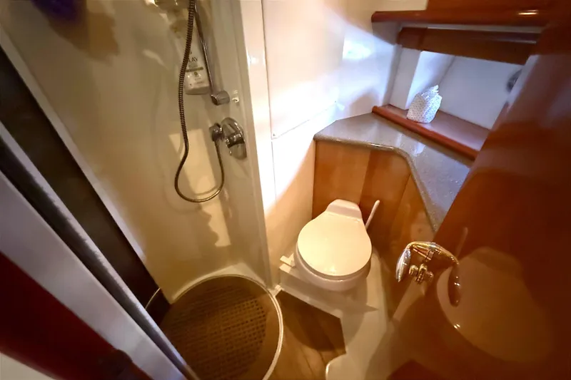 Slide: The Image of Bathroom interior of 2002 Sunseeker Camargue 44 yacht, featuring shower and toilet. - 12