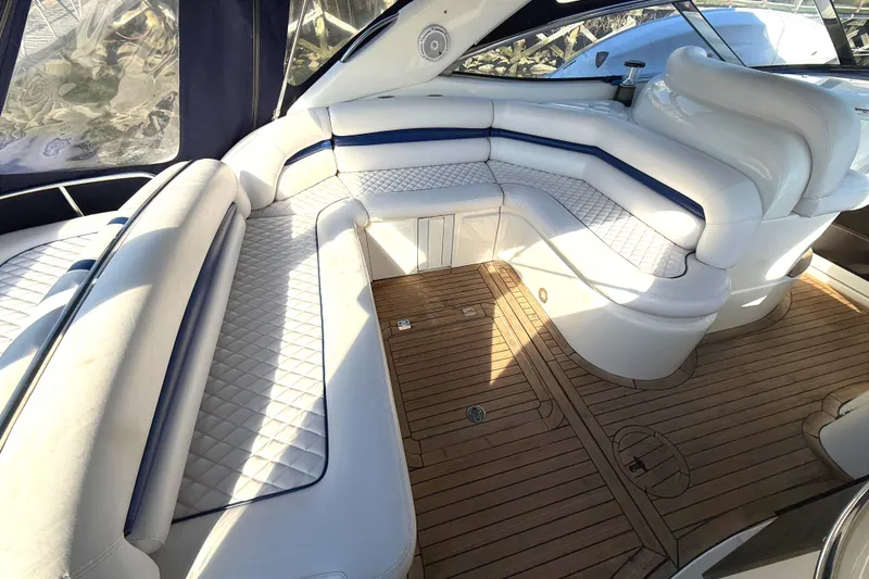 Slide: The Image of Luxurious seating area on a 2002 Sunseeker Camargue 44 yacht with wooden flooring. - 14