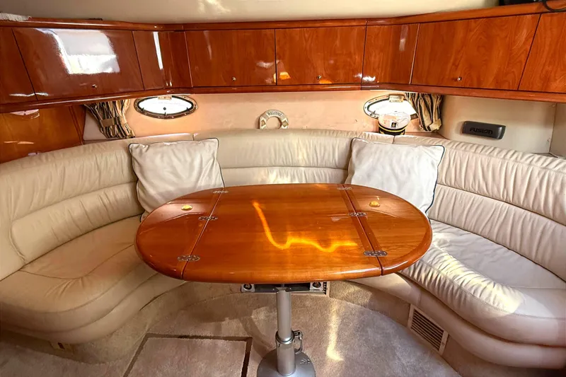 Slide: The Image of Luxurious interior of 2002 Sunseeker Camargue 44 yacht with elegant wood and leather seating. - 8