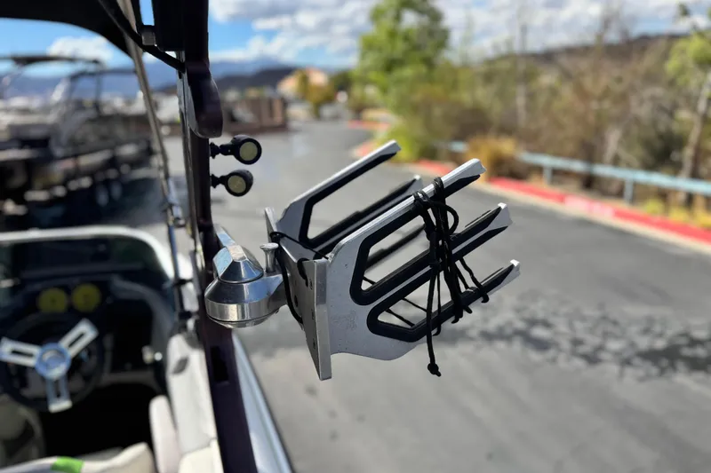 Slide: The Image of Wakeboard rack on a 2014 Centurion Enzo SV244 boat, parked outdoors. - 12