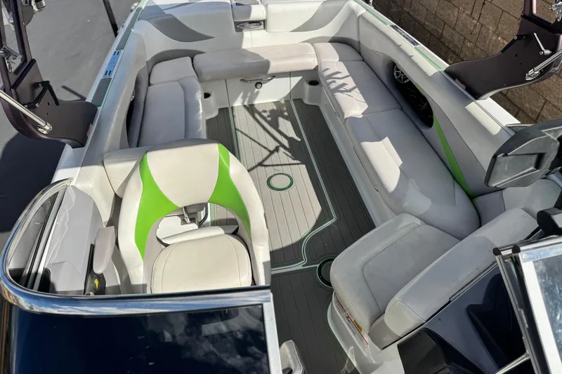 Slide: The Image of Interior of 2014 Centurion Enzo SV244 boat with white and green seating. - 14