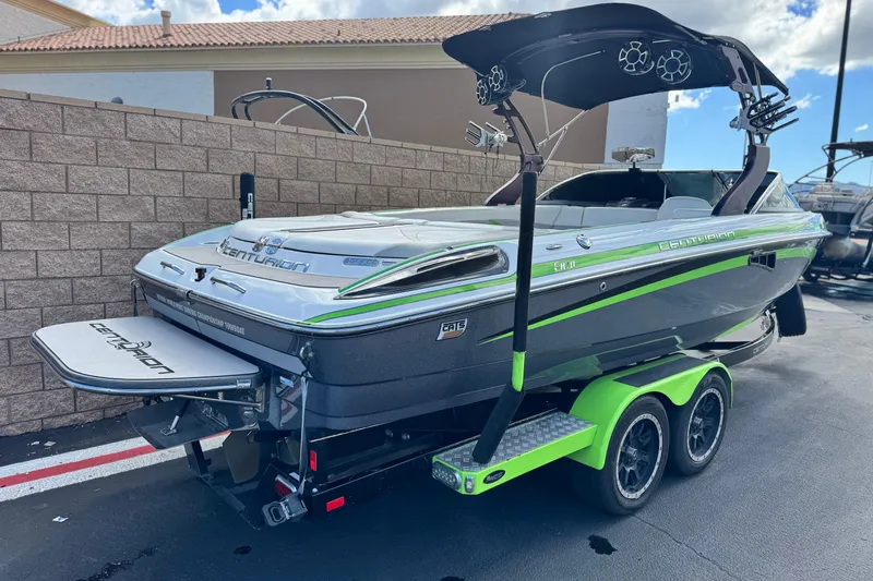 Slide: The Image of 2014 Centurion Enzo SV244 boat on trailer, featuring sleek design and vibrant accents. - 6