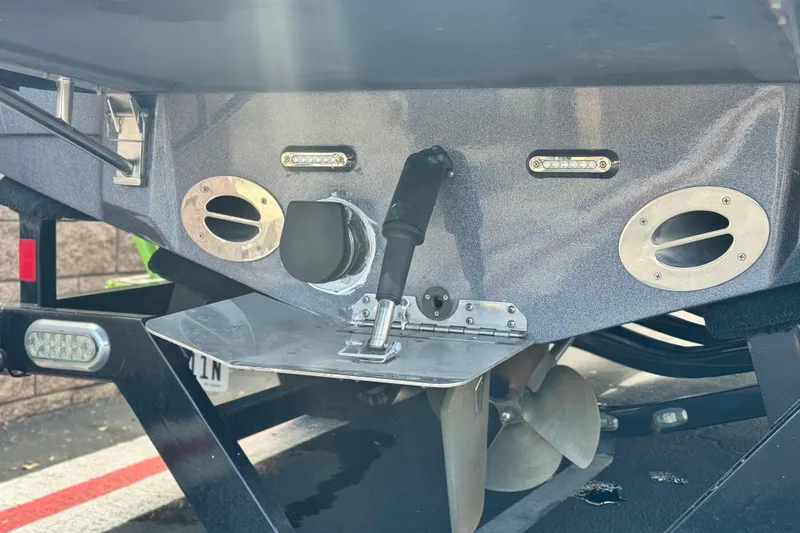 Slide: The Image of Rear view of a 2014 Centurion Enzo SV244 boat showing propeller and exhaust system. - 8