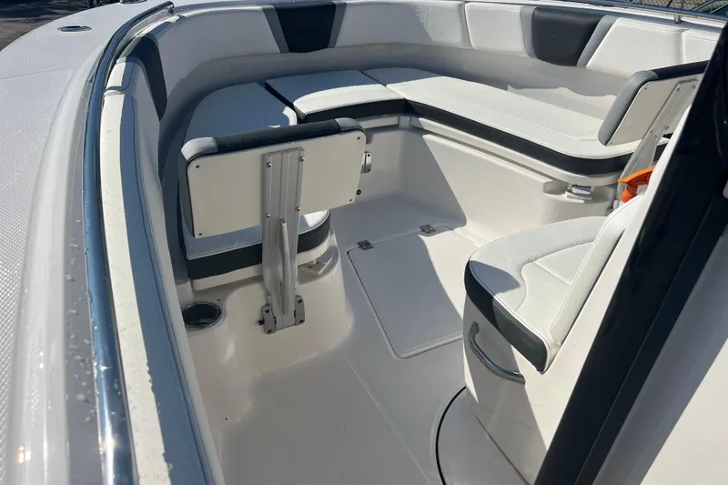 Slide: The Image of 2025 Robalo R270 Center Console boat interior with cushioned seating and sleek design. - 10