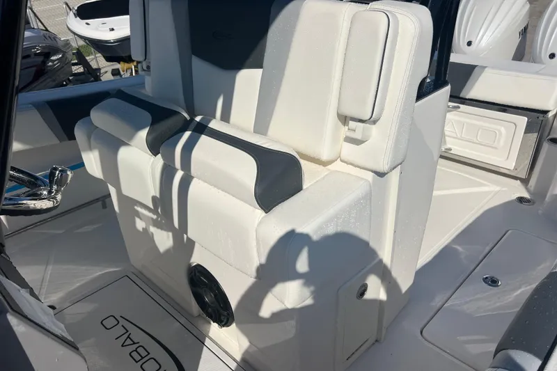 Slide: The Image of 2025 Robalo R270 Center Console boat interior with cushioned seating and modern design. - 13